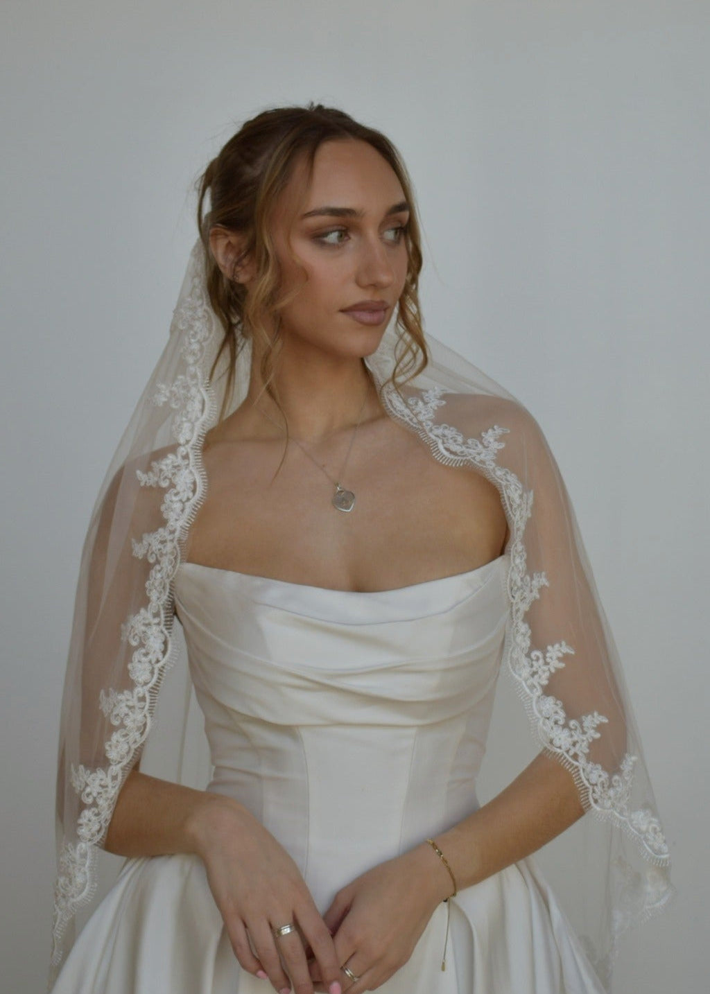 bride in lace veil