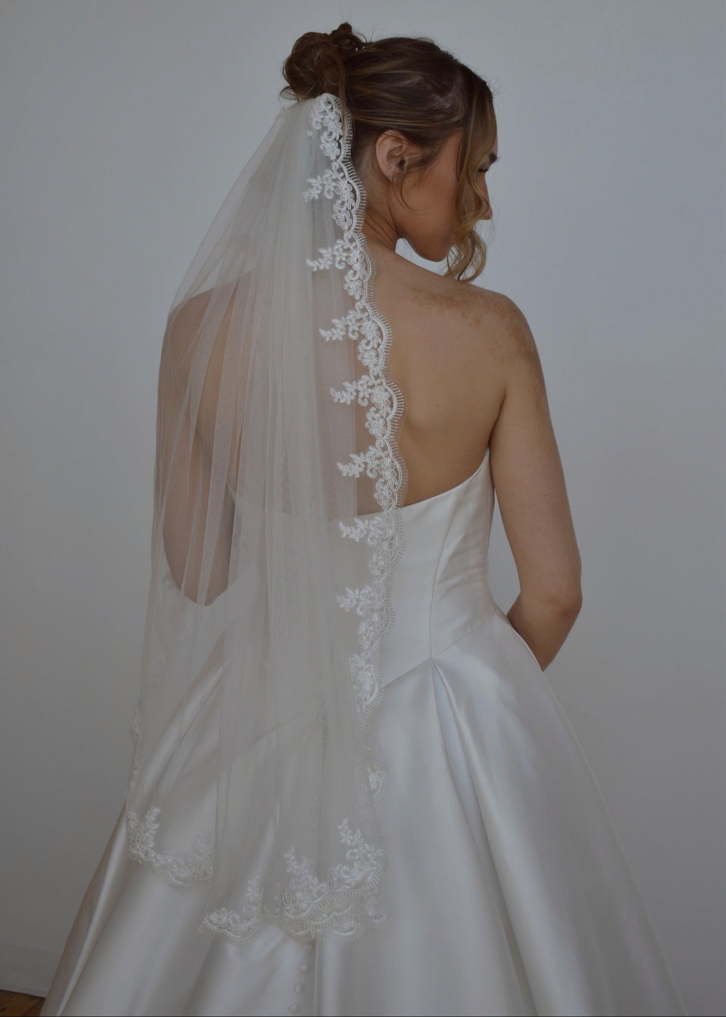 fingertip lace veil on a-line wedding dress