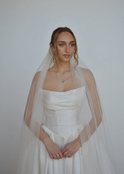 Bride wearing tulle veil in cathedral length