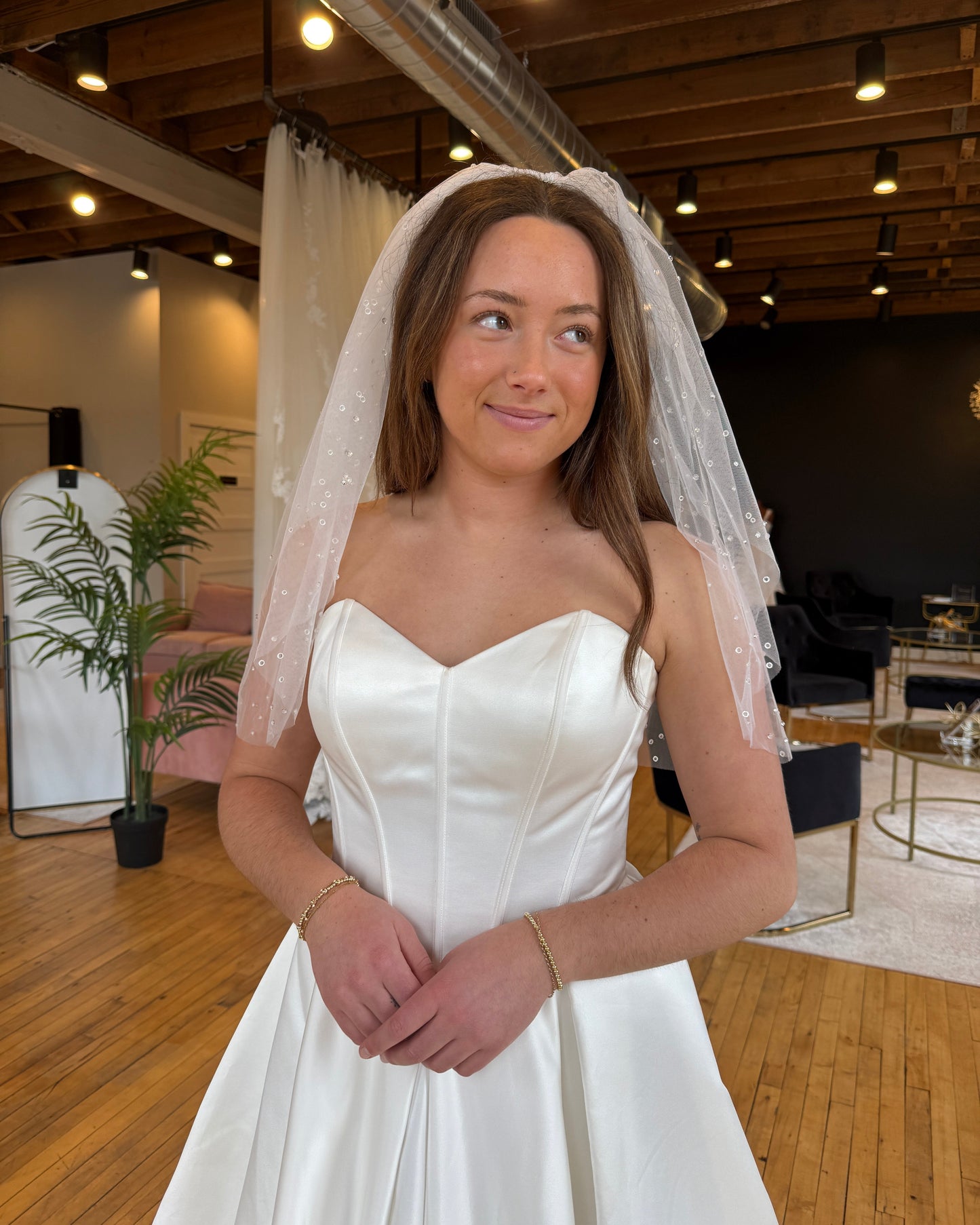 Bride wearing raindrop effect veil