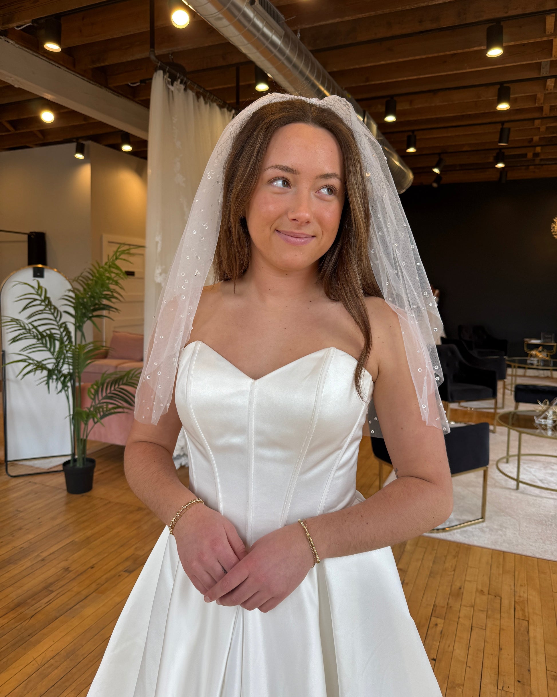 Bride wearing raindrop effect veil